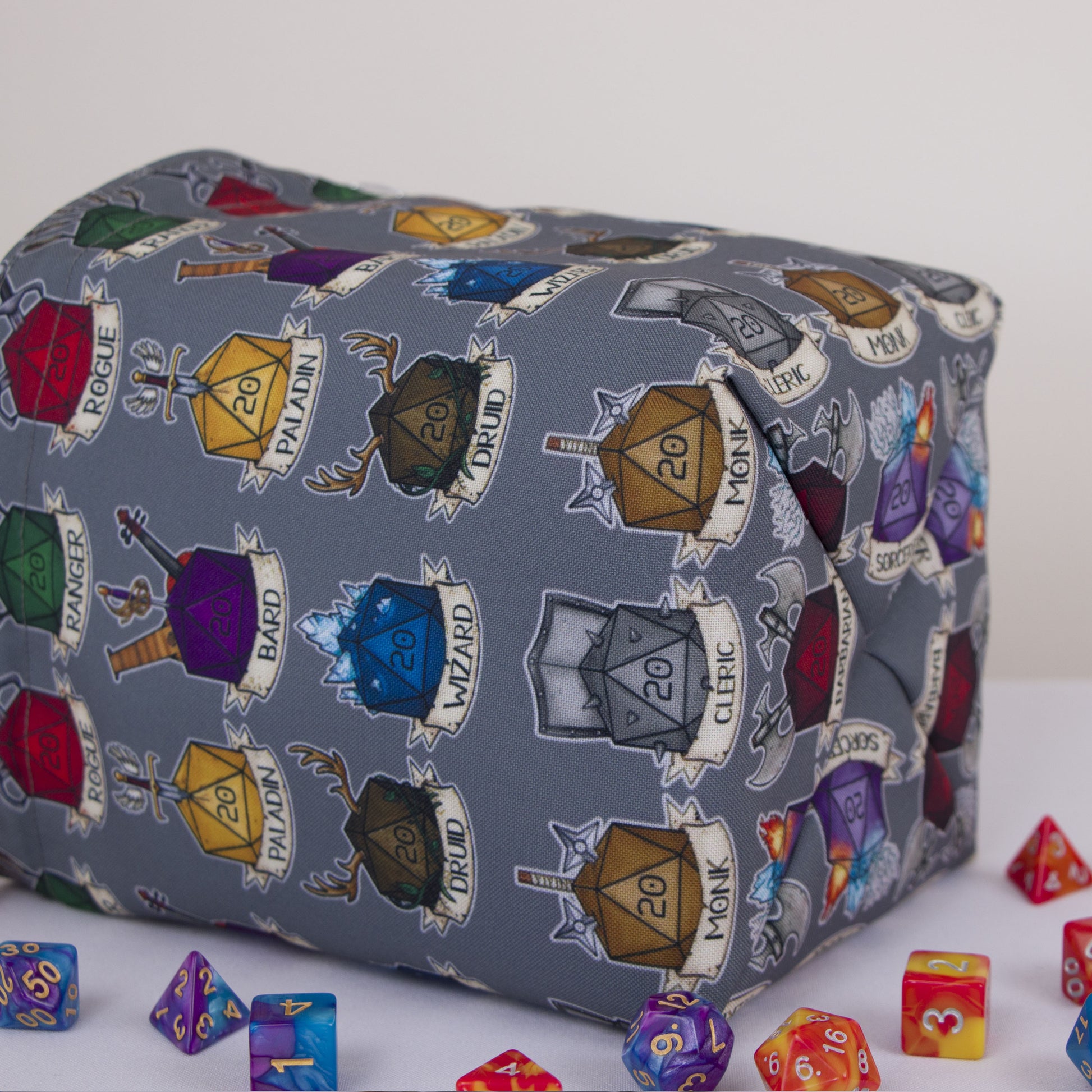 Class crest dice bag with rainbow pockets for sorting dice by character.