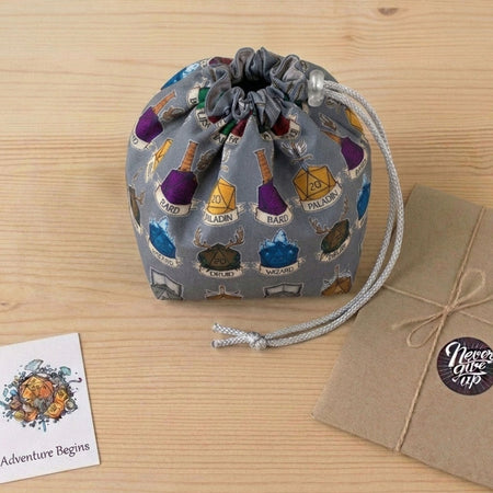 DnD party gift — class crest dice bag with pockets for a Dungeon Master, holds 300+ dice.