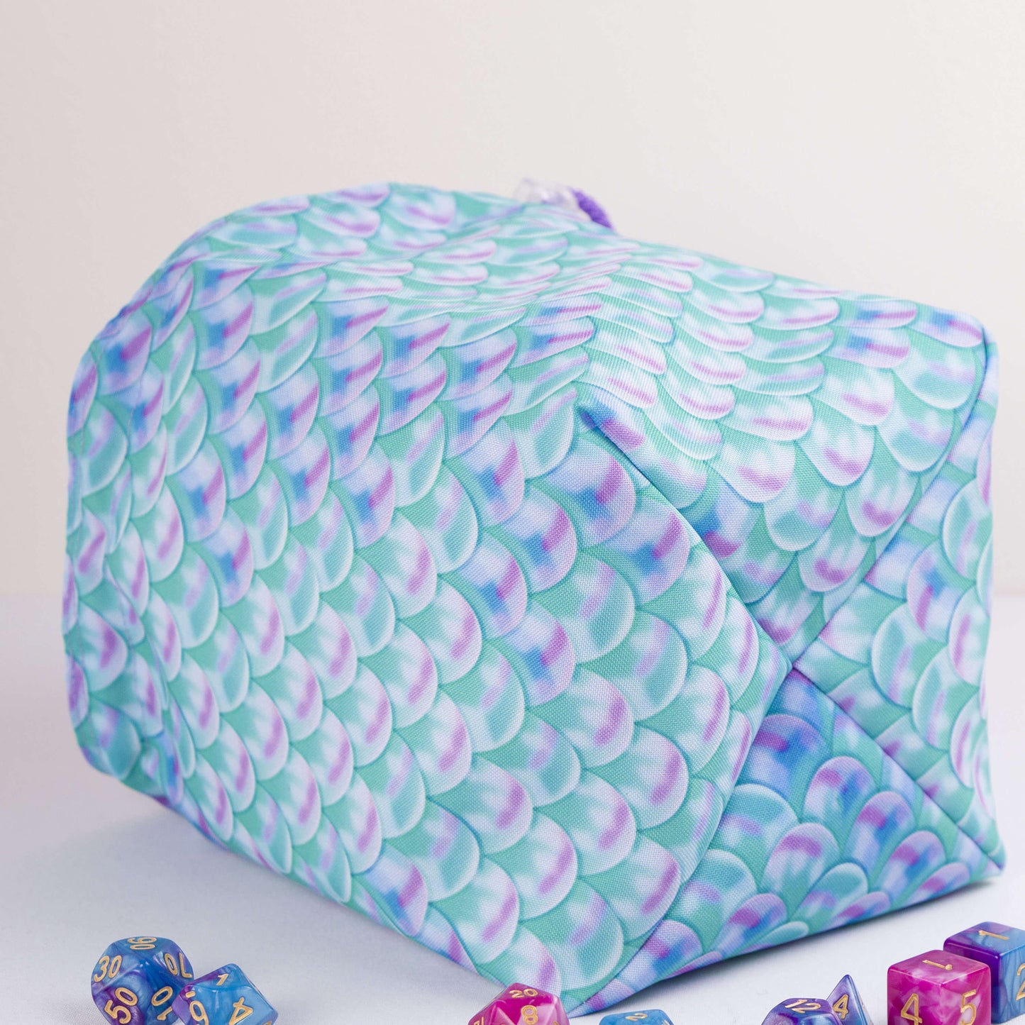 Pastel scale dice bag with rainbow pockets for sorting dice by set.