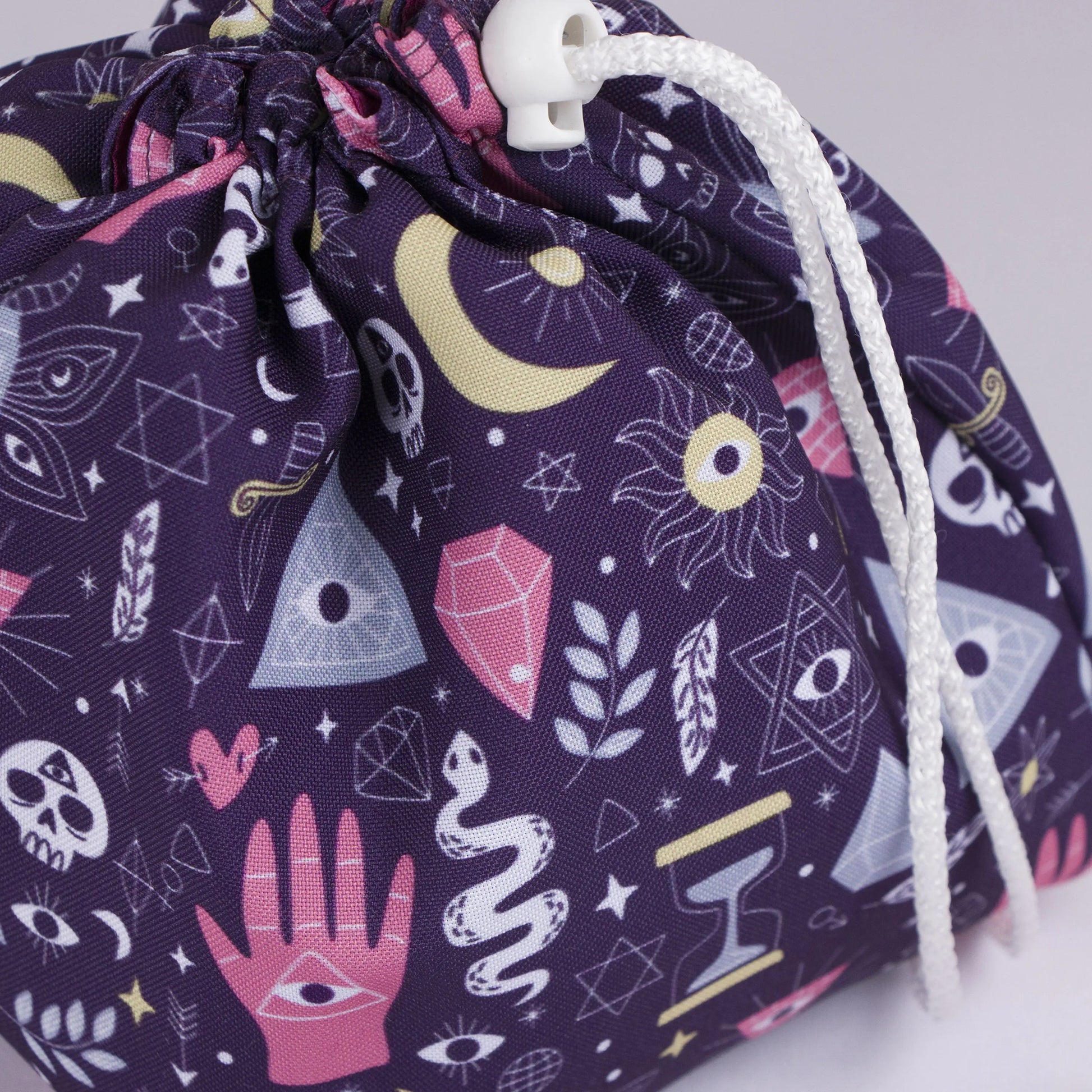 Mystic hand dice bag held in hand — handmade witchy gabardine DnD organizer.