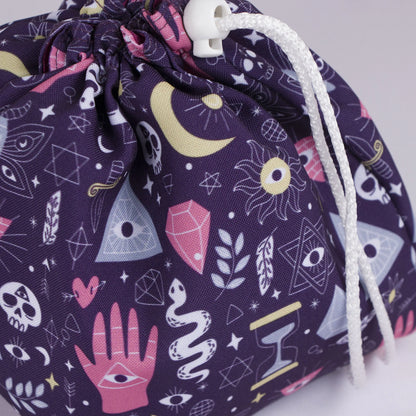 Mystic hand dice bag held in hand — handmade witchy gabardine DnD organizer.