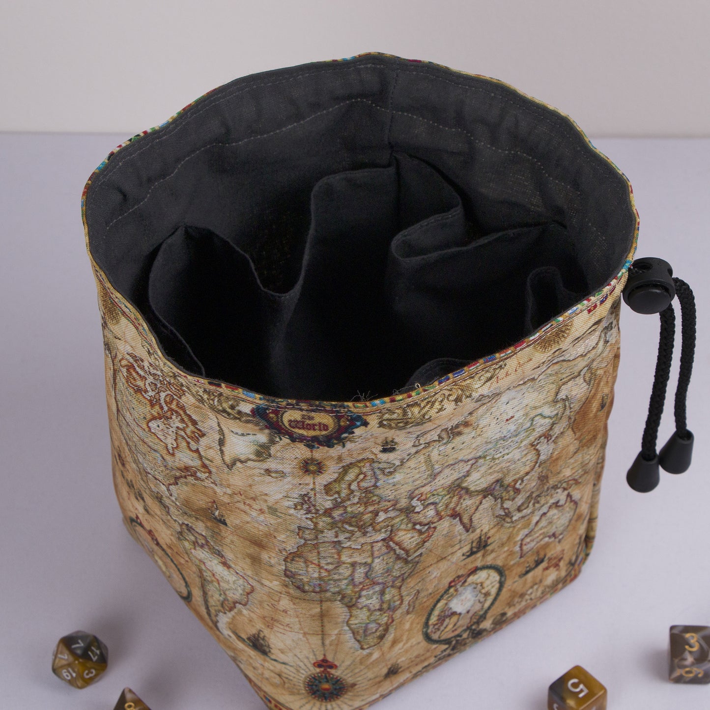 Old world map dice bag with rainbow pockets for sorting dice by campaign.