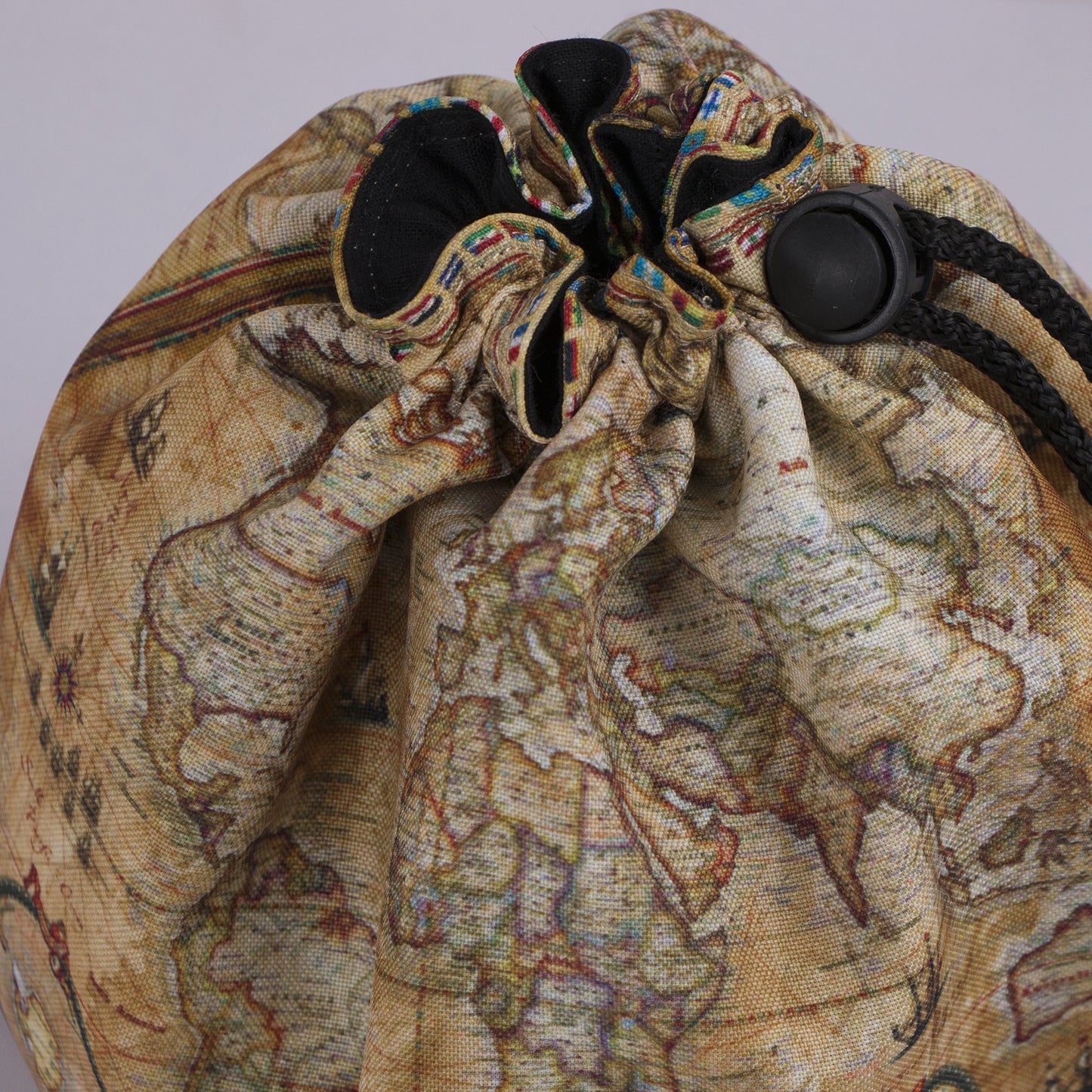 Cartographer dice bag standing open — large handmade DnD dice organizer.