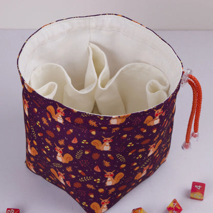 Open squirrel dice bag showing the soft cotton lining that protects dice.
