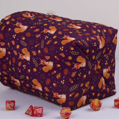 Squirrel dice bag with orange drawstring closure — cute cottagecore DnD pouch.