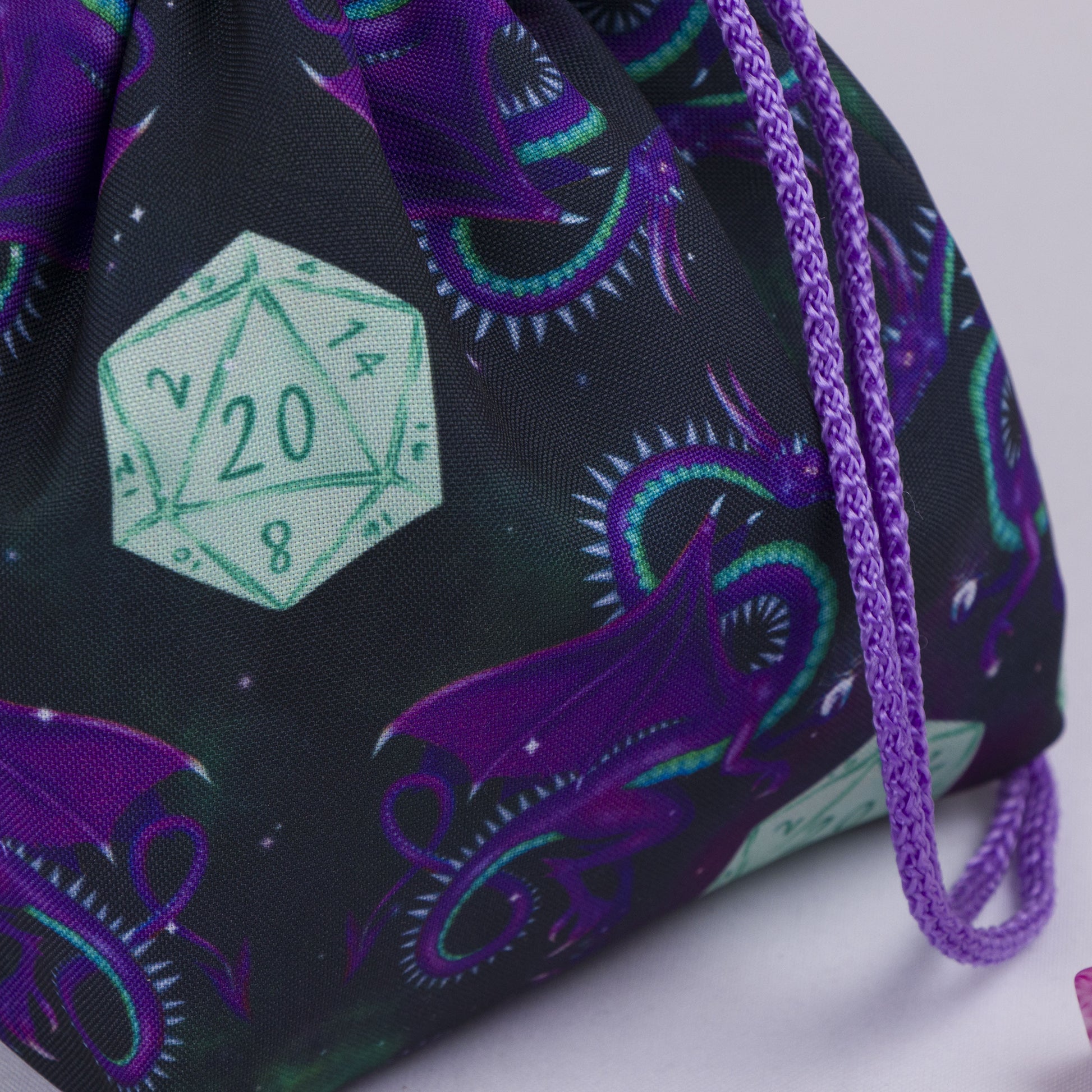 Galaxy dragon dice bag with rainbow pockets for sorting dice sets.