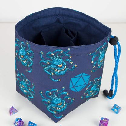 Beholder dice bag shown with dice for scale — handmade DM monster organizer.