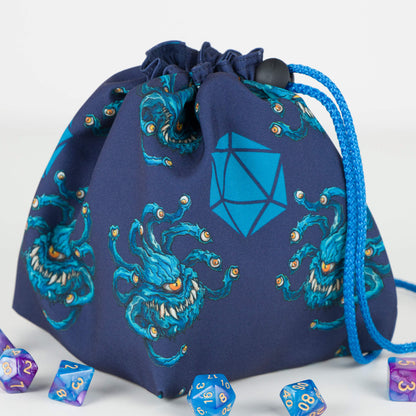 Handmade beholder dice bag — teal eye-tyrant monsters and a D20 on navy gabardine, holds 300+ dice.