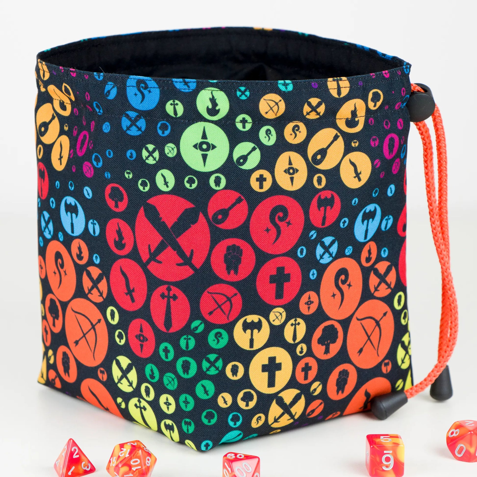 Rainbow class icons dice bag with orange drawstring — colorful DnD birthday gift pouch.
