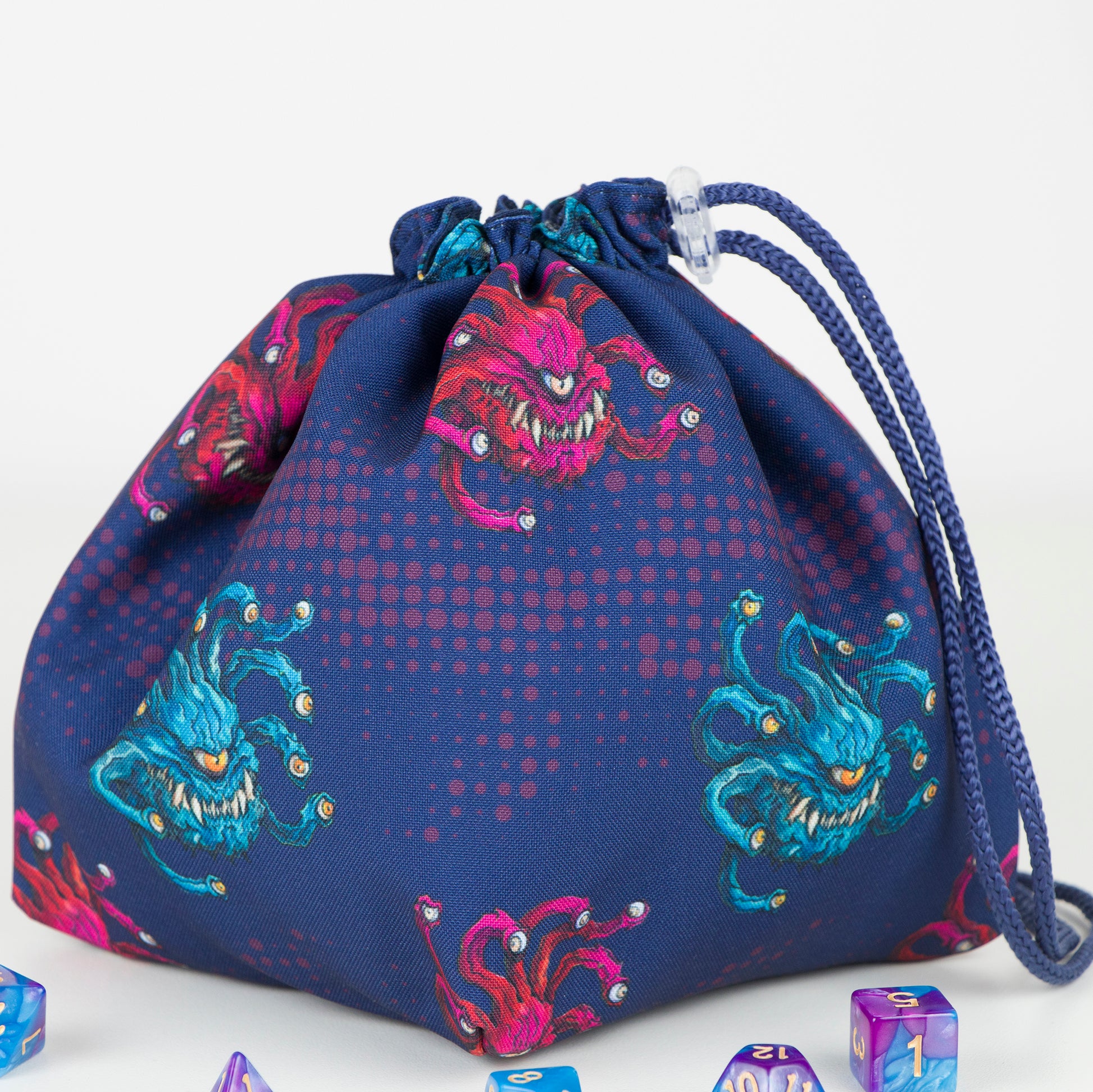Dice Bag beholder — handmade monster-themed dice pouch, perfect for dungeons and dragons gifts or as a practical rpg dice bag. Crafted with durable gabardine exterior and soft 100% cotton lining, this bag is available as a classic pouch or 6-pocket organizer for dice sets. Freestanding design with 5" square base and 7" height, secure drawstring closure with plastic clip. Ideal for dice storage, tokens, and RPG accessories. Gift-ready, eco-friendly, and handmade with love.