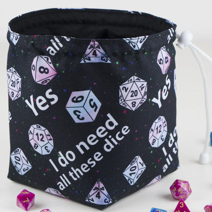A funny DnD birthday gift — 'Yes I do need all these dice' print with pastel dice on starry black, holds 300+ dice.