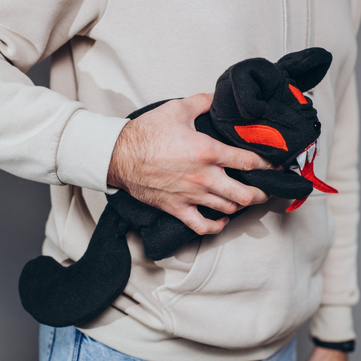 Demonic black cat plush dice bag — dnd plush dice bag that arrives looking like a gift.