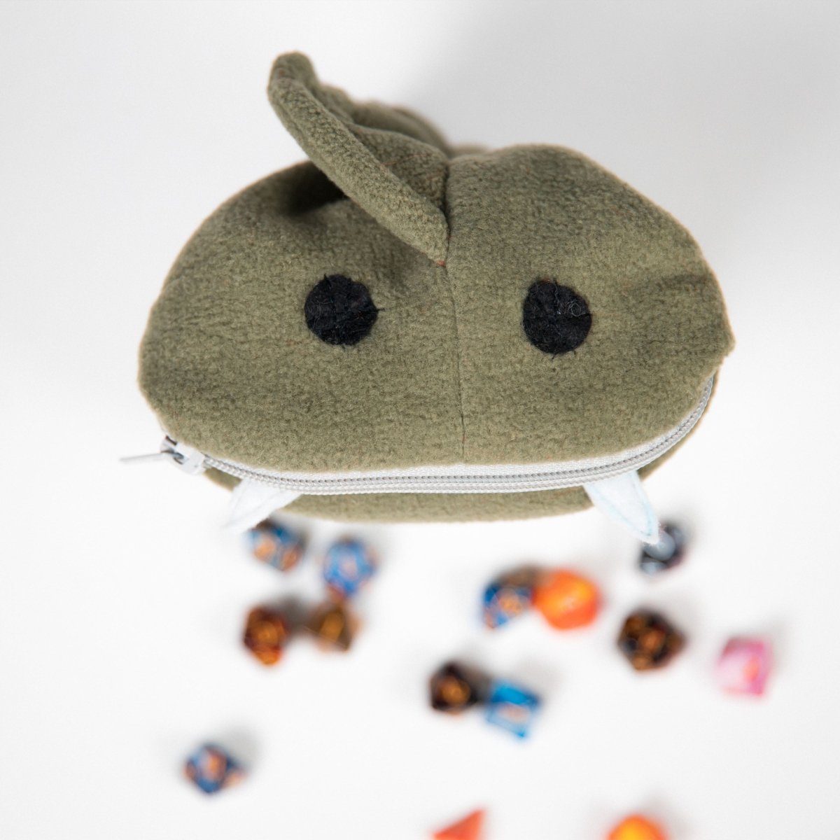 Cute green fish monster plush dice bag — dnd plush dice bag that arrives looking like a gift.