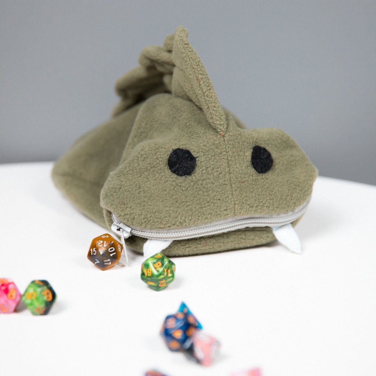 Cute green fish monster plush dice bag — fuzzy dice bag with soft lining that cushions metal and resin dice.