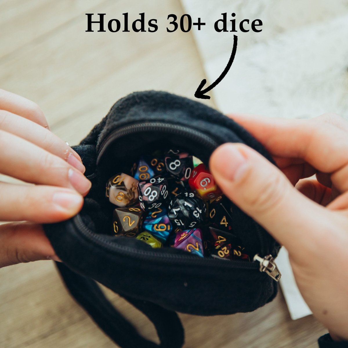 Skull ita bag — ita bag with a dice bag charm clip for convention display.