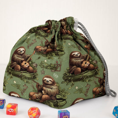 Cozy sloth dice bag with pockets — handmade gabardine DnD organizer holding 300+ dice across 6 pockets.